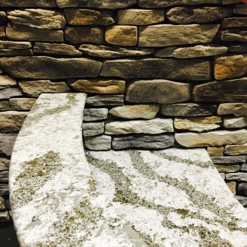 installing a rock wall is a rustic yet extravagant way to add interest to a wall in either a commercial or residential installation