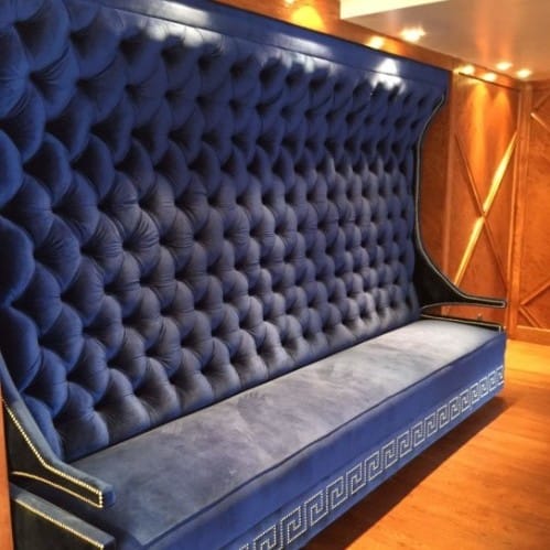 built-in furniture like this beautiful banquet seating in vivid blue fabric, is a way to feature a wall