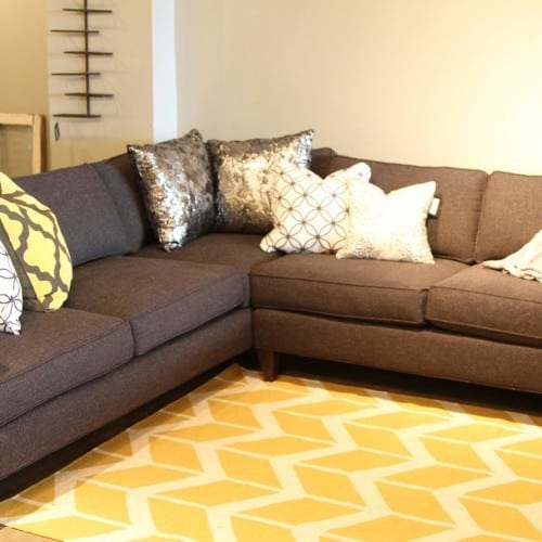 adding throw pillows with varying patterns create visual interest and a mix of textures