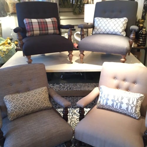 These four Logan chairs in neutral shades have small contrasting pillows to bring in patterns and additional color