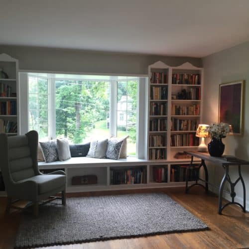 First impressions are everything and creating warmth and spaciousness is key when showing a home for sale. Adding a woven rug, console with a lamp and mix of pillows and organizing the bookshelves in their entry way does just that