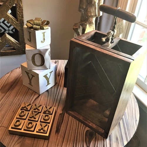 Create little moments of fun in entertaining spaces with accessories like this gold tic-tac-toe board